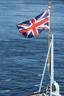 Union Jack flag waving on a yacht